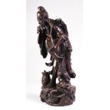 A Chinese Carved Rosewood Figure of a Fisherman With His Catch, Early 20th Century