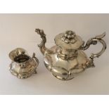 Antique silver teapot and cream jug