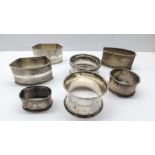 Collection of 7 continental silver serviette rings