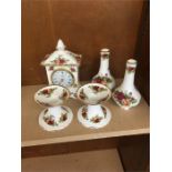 Selection of old country rose vase clock and candle stick