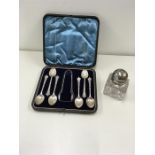 Box set of silver tea spoons and sugar tongs and victorian silver top ink well