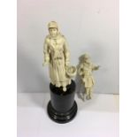 Pair of Antique Dieppe Ivory Figures A/F one standing on marble base damage to foot only stands app