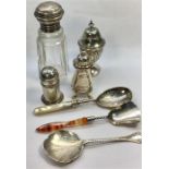 Collection of Silver Items includes 3 pepper pots Silver spoons etc