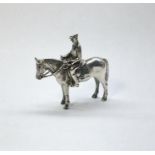 Silver miniature figure of rider mounted on his horse