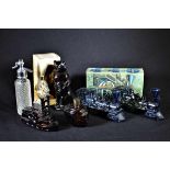 Collection de 7 figurines flacons de parfum. Hauteurs: 9cm à 21cm.