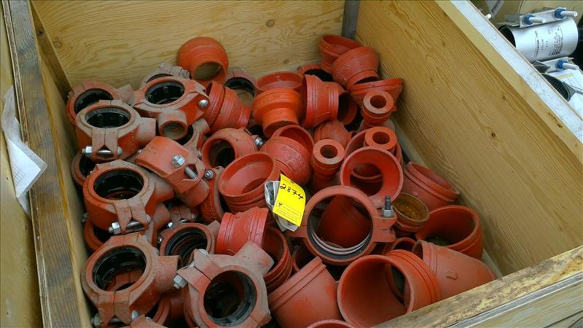 [2874] (1 crate) misc. Victaulic pipe fittings; clamps, reducers, etc.