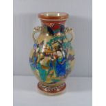 Large oriental vase with stylized elephant handles and figeral decoration approx. 15" tall