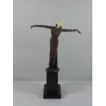 Deco style cast bronze figure of a dancing girl on plinth with carved bone face