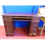 Mahogany pedestal desk with red leather skiver