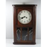 Small wooden cased wall clock