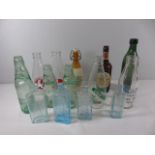 14 Various old bottles to include named milk bottles