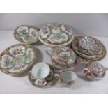 Oriental tea and dinner ware in Famille Rose pattern approx. 45 pieces