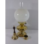 Brass oil lamp, hand bell and napkin ring