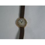 9ct gold cased laides wrist watchg with with a brown leather strap