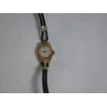 Vintage gold cased ladies watch by Lance with a leather strap