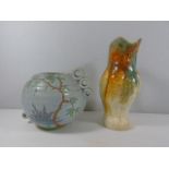 Crown Devon vase with floral decoration and a jug in the form of a parrot