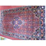 Large multi coloured Persian carpet with fringed e