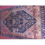 Large handmade Persian rug with blue and red decor