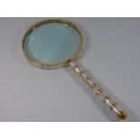 Large brass and mother of pearl magnifying glass approx. 24.5" long