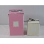 2 Boxed candles 1 pink 1 white