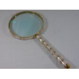 Large brass and mother of pearl magnifying glass approx. 24" long