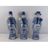 3 Blue and white oriental figures of men each approx. 12" tall