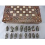 Games compendium with metal chess pieces and inlaid draughts pieces