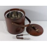 Antique style leather ice bucket with a pair of tongs and a stainless steel liner