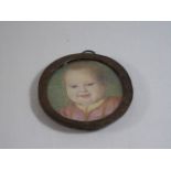 Brass framed miniature of a young child