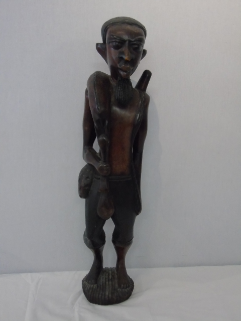 Large carved figure of a tribal man carrying his kill approx. 29" tall - Image 2 of 4