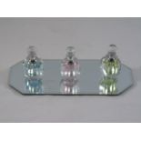 3 Glass scent bottles on mirrored tray