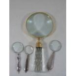 Large magnifying glass together with 3 smaller examples