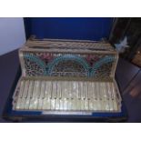 Very ornate piano accordion by Settimio in a hard case