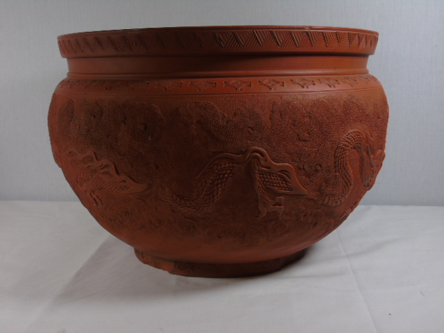 Large oriental terracotta planter approx. 14.5" dia decorated with dragon detail