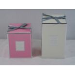 2 Boxed candles 1 pink and 1 white