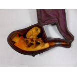 Meerschaum pipe with a carving of an owl standing on a branch in original case