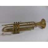 Cased brass trumpet complete with mouth piece