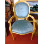 Modern carver chair with blue fabric upholstery