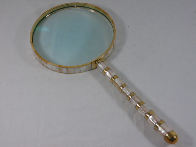 Large brass and mother of pearl magnifying glass approx. 24.5" long