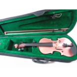 Cased pink child's violin and bow