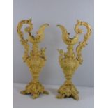 Pair of very ornate cast iron jugs with cherub decoration approx. 16"