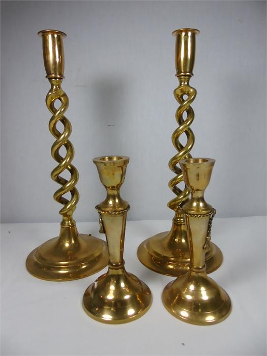 Pair of brass candlesticks with twisted stem approx. 12" Pair of brass candlesticks approx. 6.5"