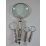 Large magnifying glass along with 3 smaller examples