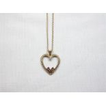 9ct Gold heart pendant with 3 small amethysts on a gold chain