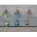 Set of 3 scent bottles on a mirrored stand