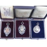 3 Boxed silver fobs