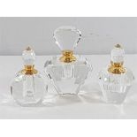 3 Cut glass scent bottles in various shapes