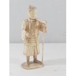 Antique carving of an oriental man with traditional farming tool, approx. 6.5" tall