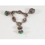 Silver charm bracelet with 3 jade set charms
