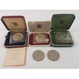 3 Boxed proof coins plus two crowns